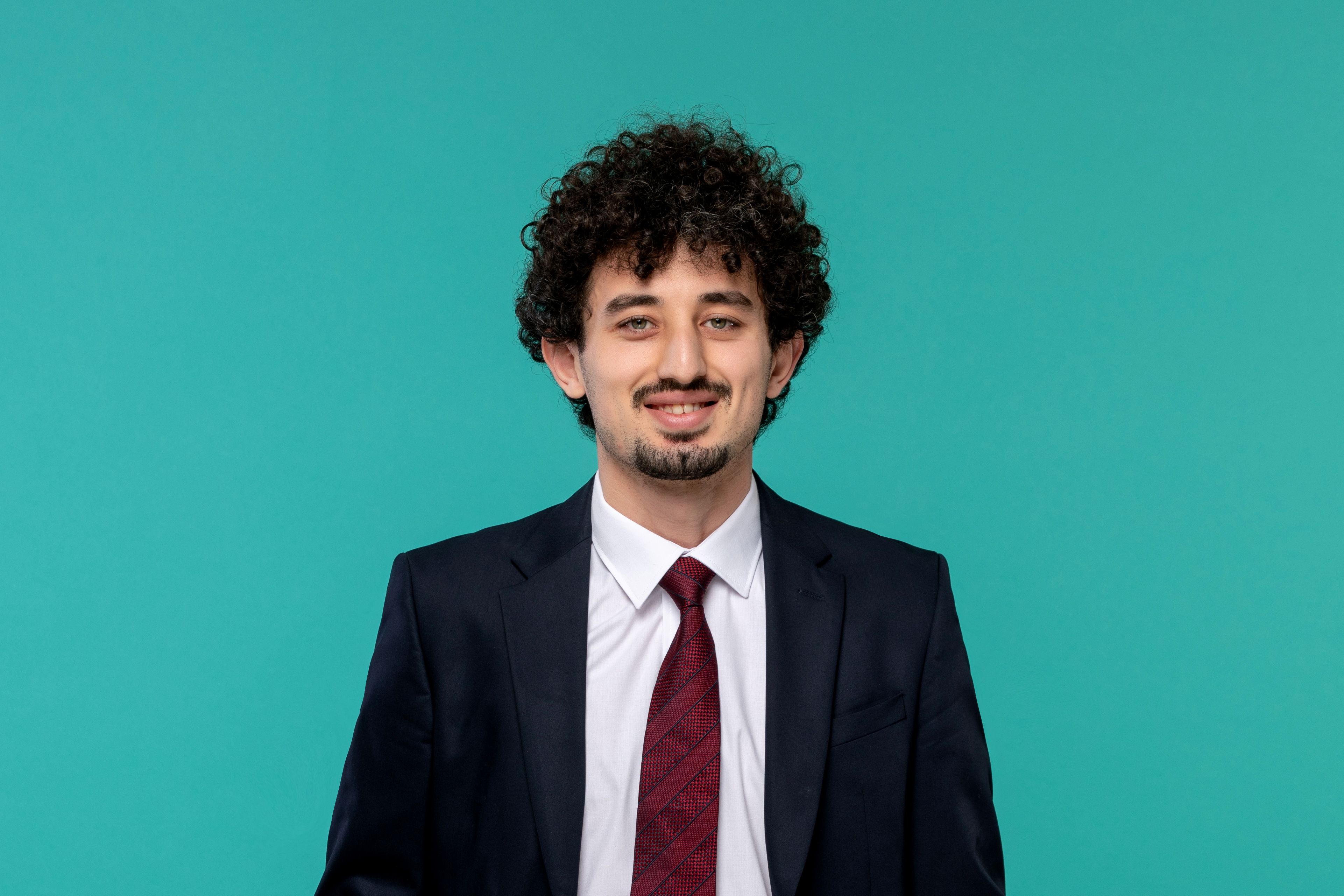 business man curly cute handsome guy black suit close up smiling